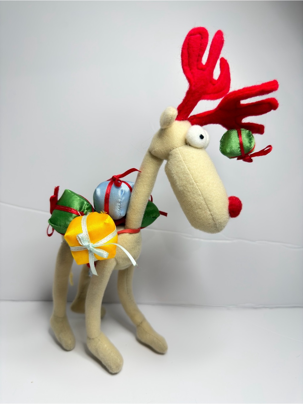 Plush Reindeer Holiday Decor with Colorful Ornaments